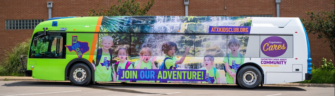 CapMetro bus wrapped with ATX KIDS CLUB branding, featuring children in green shirts and the slogan 'Join Our Adventure!